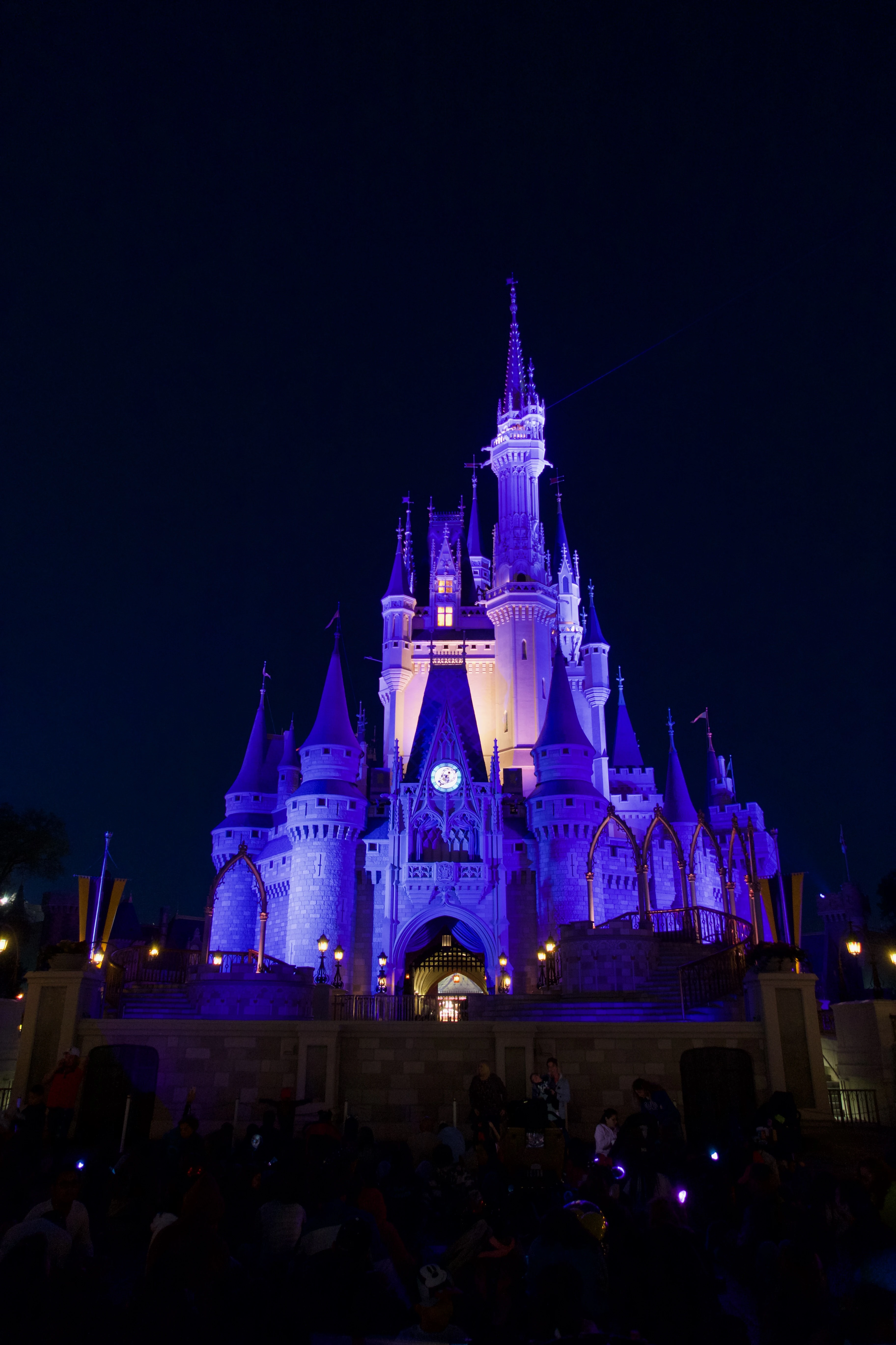 Cinderella Castle at Magic Kingdom with families enjoying Disney World attractions