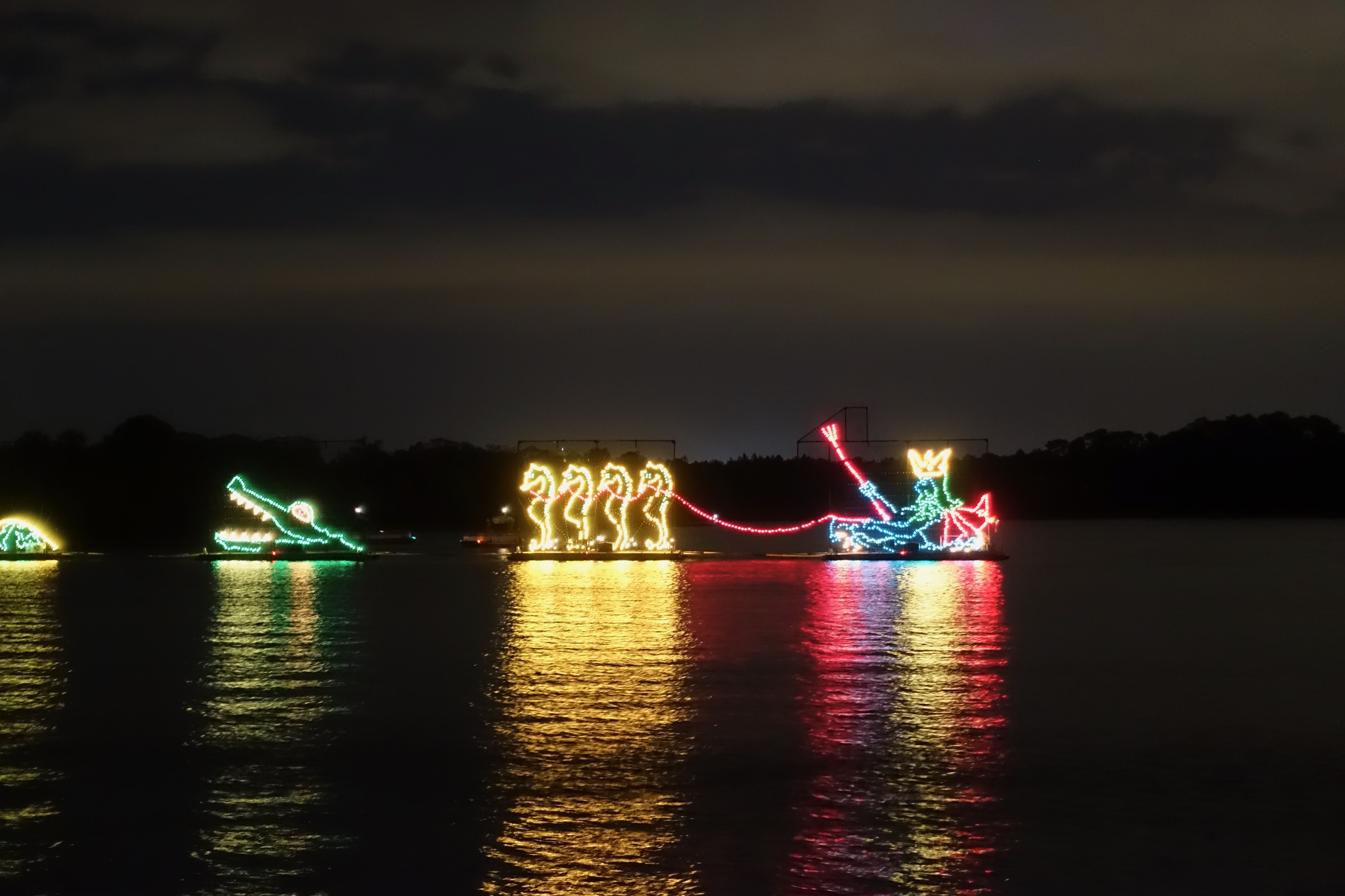 Disney's Electrical Water Pageant lighting up the Seven Seas Lagoon with colorful floating displays